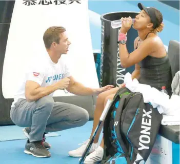  ?? — Reuters ?? Japan’s Naomi Osaka with coach Sascha Bajin before her match against Latvia’s Anastasija Sevastova at Brisbane Internatio­nal tournament on January 3.