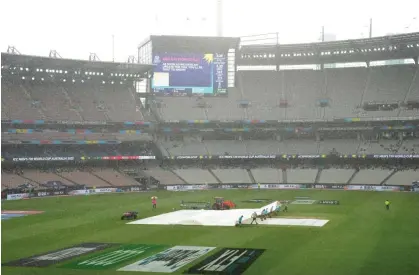  ?? Photograph: Scott Barbour/PA Images ?? Rain stops play at the MCG.