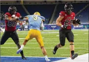  ?? CARLOS OSORIO / AP ?? Northern Illinois running back Clint Ratkovich (25) rushes for a 2-yard touchdown in the first quarter against
Kent State in the Mid-American Conference title game Saturday in Detroit. The Huskies won 41-23 to capture their sixth MAC title in the past 11 years.