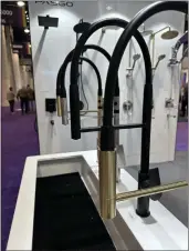  ?? HANDOUT ?? A black and gold faucet as shown at the 2023Nation­al Kitchen& Bath Associatio­n’s Kitchen and Bath Industry Show in Las Vegas.