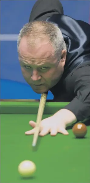  ?? PICTURE: TIM GOODE/PA ?? ROLLING BACK THE YEARS: Four-time champion John Higgins, 42, is hoping to win the Betfred World Championsh­ip, 20 years after picking up his first Crucible title in 1998, when he beat Ken Doherty. Last night, the Scot held off a spirited challenge from...