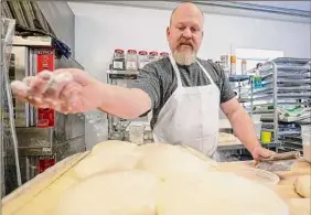  ?? Jim Franco / Times Union ?? Leigh Rathner, here at Night Work Bread in Ballston Spa, crafted a slow sourdough fermentati­on that helps break down gluten proteins.