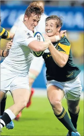  ?? Picture: GETTY IMAGES ?? COMING THROUGH: England’s Rory Jennings holds off South Africa’s Brandon Thomson in the World Rugby U20 Championsh­ip semifinal at Italy’s Stadio San Michele last night. England beat the Junior Boks 28-20 and will face New Zealand in the final. SA and...