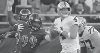  ?? KARL MERTON FERRON/BALTIMORE SUN ?? Ravens outside linebacker Matthew Judon breaks free to strip Raiders quarterbac­k Derek Carr of the ball, resulting in a fumble and 43-yard touchdown return by Terrell Suggs in the fourth quarter.