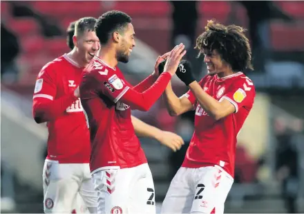  ?? Picture: David Davies/PA ?? Zak Vyner is congratula­ted on his goal against Preston by Han-Noah Massengo