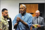  ?? JASON BEAN / THE NEW YORK TIMES ?? O.J. Simpson reacts after learning he would be granted parole, at a hearing at the Lovelock Correction­al Center in Nevada on Thursday.