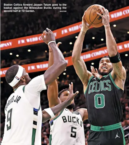  ?? REUTERS ?? Boston Celtics forward Jayson Tatum goes to the basket against the Milwaukee Bucks during the second half at TD Garden.