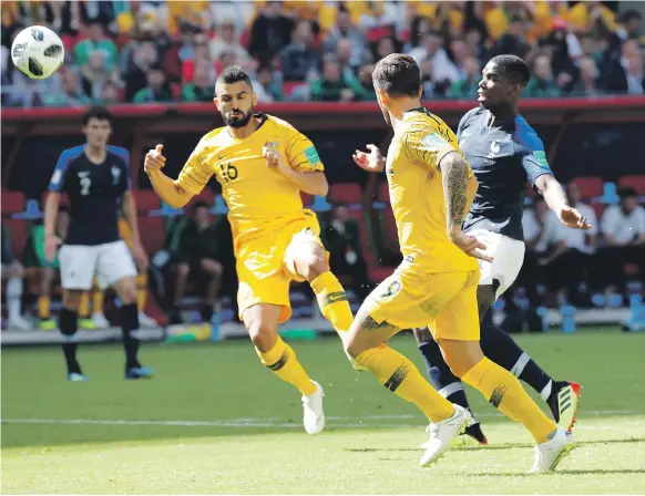  ??  ?? Both of France’s goals, including the eventual winner from Paul Pogba, right, involved the input of technology as they beat Australia in Kazan