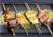  ?? St. Louis Post-Dispatch-Tribune News Service ?? Yakitori (or chicken on a skewer) versions, left to right, tare style, torikawa, with shio (or salt) and reba (or livers)