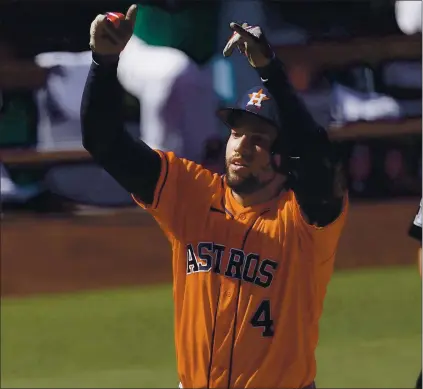  ?? ASHLEY LANDIS — THE ASSOCIATED PRESS ?? The Astros’ George Springer celebrates after hitting the first of his two home runs against the Athletics during the third inning of Game 2.