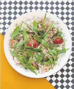  ?? BIANCA RAGOGNA ?? The tomato salad at Donna’s pairs heirloom and cherry tomatoes with smoked fish dip and tarragon.