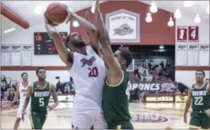  ?? JOHN BLAINE — FOR THE TRENTONIAN ?? Rider’s Tyere Marshall, left, shoots over Siena’s Denzel Tchougang, right, during a MAAC game this season.