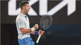  ?? Julian Finney/Getty Images ?? Novak Djokovic celebrates during a fourth-round singles match against Adrian Mannarino on Sunday.
