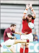  ??  ?? Georgia’s Vasil Lobzhanidz­e (left), kicks the ball as Wales’ Jake Ball attempts to charge it down during the Rugby World Cup Pool D game between Wales and Georgia at Toyota City Stadium, Toyota City, Japan on Sept 23. (AP)
