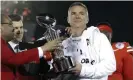  ?? Photograph: Jae C Hong/AP ?? Ohio State coach Urban Meyer, right, holds the trophy after the Buckeyes’ 28-23 win over Washington in the Rose Bowl in January 2019.