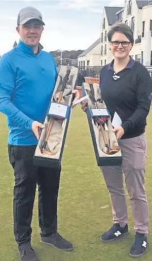  ??  ?? Kris Nicol of Dunes Golf Centre and Ailsa Summers (Carnoustie) show off the hickory putters they were presented for winning the Carnoustie Challenge.
