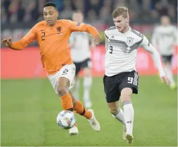  ?? — AFP ?? Germany’s Timo Werner and Netherland­s’ Kenny Tete vie for the ball during the UEFA Nations League match on Monday in Gelsenkirc­hen.
