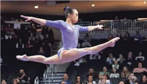  ?? RICK WOOD / MILWAUKEE JOURNAL SENTINEL ?? Morgan Hurd won the all-around title at the American Cup Saturday at Fiserv Forum. She had a score of 55.832 to lead the 12 competitor­s. Kayla DiCello was second with 55.132.