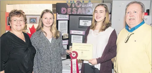  ?? BRIAN SIMPSON/SPECIAL TO THE GUARDIAN ?? The Human Rights Commission (HRC) presents its English award at the Provincial Heritage Fair to Emma Palmer and Emma Coughlin, Grade 8 students from Hernewood Intermedia­te School, for their project on Viola Desmond. From left, are HRC executive...