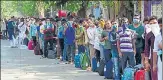  ?? BHUSHAN KOYANDE/HT PHOTO ?? People wait outside CSMT to board a special train in Mumbai on Monday.