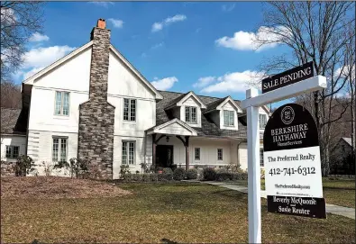  ?? AP ?? This March photo shows a house for sale in Sewickley, Pa. The National Associatio­n of Realtors said Wednesday that sales of previously owned homes sank last month to a seasonally adjusted annual rate of 5.35 million.