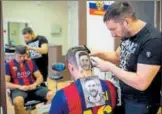  ?? AFP ?? Craze for the Messi hair tattoo has caught on in Serbia.
