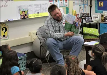  ?? COURTESY PHOTO ?? Andrew Leimgruber reads to third graders at Meadows Union School in El Centro Thursday at the inaugural Read a Book with a Farmer Day.