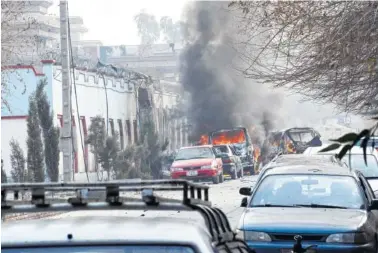  ?? THE ASSOCIATED PRESS ?? Vehicles burn after a deadly suicide attack Wednesday in Jalalabad, east of Kabul, Afghanista­n.