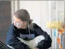  ?? COURTESY ?? After being discharged from the hospital, Lilly Downs, 17, still has to take liquid food through a tube at her home in Golden, Colorado, on Sept. 17.