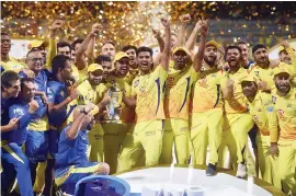  ??  ?? CSK rejoice with the IPL 2018 trophy on May 27, its third title in 11 years of the T20 tournament