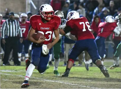  ?? RECORDER PHOTOS BY CHIEKO HARA ?? Strathmore High School running back Joseph Garcia runs with the football during the first half of Friday nights 6-AA Northern California Regional Championsh­ip at Spartan Stadium. Garcia rushed for five touchdowns in the Spartans’ 49-35 win.