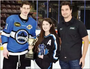  ?? DAVID CROMPTON/Penticton Herald ?? Forward Ryley Risling receives the Penticton Vees Most Improved Player award from Penticton Vees female midget rec team player Stephanie Lagrange and Brett Darin of Sherwood Signs and Graphics, which sponsors the award. Risling also won the Vees on...