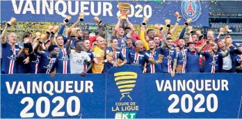  ?? AP ?? PSG players celebrate after defeating Lyon 6-5 on penalties, after their final ended in a stalemate at the end of extra time, to win French League Cup at Stade de France stadium, in Saint Denis, north of Paris, on Friday. —