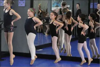  ??  ?? Dancers practise a jazz routine in preparatio­n for the upcoming recital.