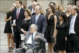  ?? EVAN VUCCI — THE ASSOCIATED PRESS ?? Former Presidents George H.W. Bush and George W. Bush accompanie­d by their family members watch as pallbearer­s carry the casket of former first lady Barbara Bush after a funeral service Bush at St. Martin’s Episcopal Church, Saturday in Houston.