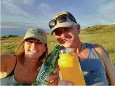  ??  ?? Enjoying the sunset and a cold one at Badlands National Park, South Dakota