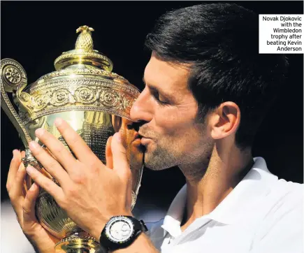  ??  ?? Novak Djokovic with the Wimbledon trophy after beating Kevin Anderson