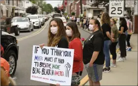  ??  ?? People stand along Philadelph­ia Ave holding signs during a Boyertown Black Lives Matter Silent Protest held in Boyertown on June 2.