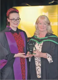  ?? IF F41 College Grad 01 ?? Heather McNeill, right, is presented with the ‘Best Academic Support’ award by Sorcha Kirker, Highlands and Islands Student Associatio­n vice president.