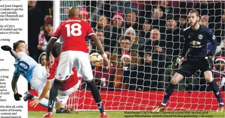  ?? REUTERSPIX ?? Manchester City’s Nicolas Otamendi scores their second goal against Manchester United’s David De Gea yesterday. –