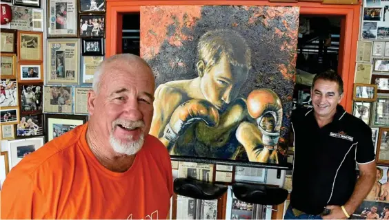  ?? Photo: Bev Lacey ?? IN MEMORY: Rick Gay (left) and Brendon Smith admire the portrait of Braydon Smith, painted by Maryika Welter. The painting will be auctioned at a fight night in March.