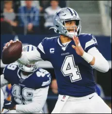 ?? Associated Press ?? NO DEAL — In this 2019 file photo, Dallas Cowboys quarterbac­k Dak Prescott (4) looks to throw in the first quarter of an NFL football game against the Los Angeles Rams in Arlington, Texas.