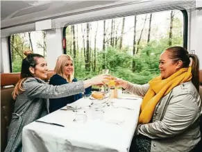  ??  ?? Private dining with large windows on GoldLeaf service carriage.