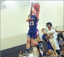  ?? File photo by Ernest A. Brown ?? Alex Hale (left) knocked down a pair of free throws with 15 seconds left in the third overtime Thursday night to lead Mount St. Charles to a 71-70 upset victory over Scituate.