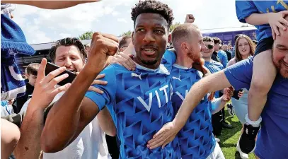  ?? Www.mphotograp­hic.co.uk ?? ●Myles Hippolyte celebrates County’s play-off semi-final victory against Salford City with Hatters fans at Edgeley Park last weekend