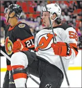  ?? Justin Tang The Associated Press ?? Devils left wing Erik Haula celebrates after scoring in the first period of New Jersey’s 5-1 victory over the Senators on Saturday at Canadian Tire Centre.