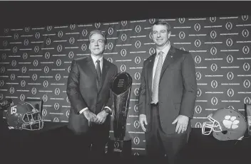  ?? Chris Carlson / Associated Press ?? Alabama head coach Nick Saban, left, and Clemson head coach Dabo Swinney have different personalit­ies, but both coaches strive to make their respective programs the best at everything.