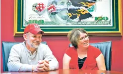  ?? KENT SIEVERS/ASSOCIATED PRESS FILE PHOTO ?? Powerball lottery winners David, left, and Erica Harrig, of Gretna, Neb., speak during a 2013 interview at the law office of their attorney Darren Carlson in Omaha, Neb. Nine years after winning, they still live as they always have.