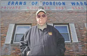  ??  ?? Paul Guilbeault, quartermas­ter at Veterans of Foreign Wars Post 3260, poses outside the building former home of the post in New Bedford, Mass.