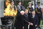  ?? AP PHOTO/CZAREK SOKOLOWSKI ?? Front from right, Israel’s President Isaac Herzog, Polish President Andrzej Duda and German President Frank-Walter Steinmeier attend Wednesday’s wreath-laying during the ‘Warsaw Ghetto Uprising’ observance in Warsaw, Poland.